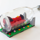 Illustration for article titled Did you know you can build Lego ships inside bottles too?